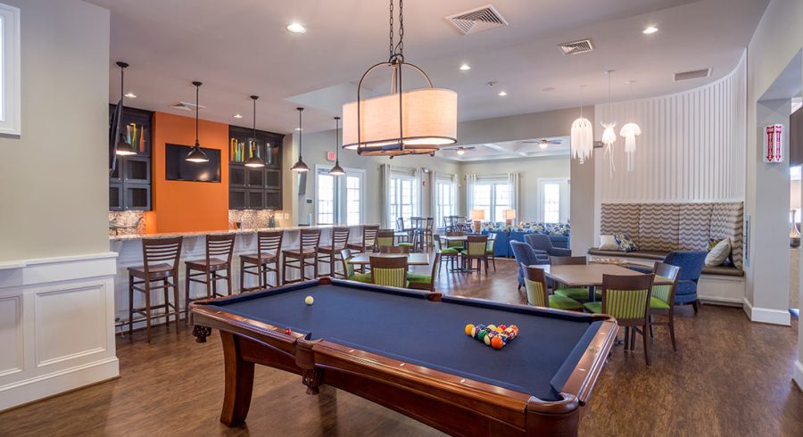 A glimpse inside the vibrant Millville by the Sea community center featuring a pool table.