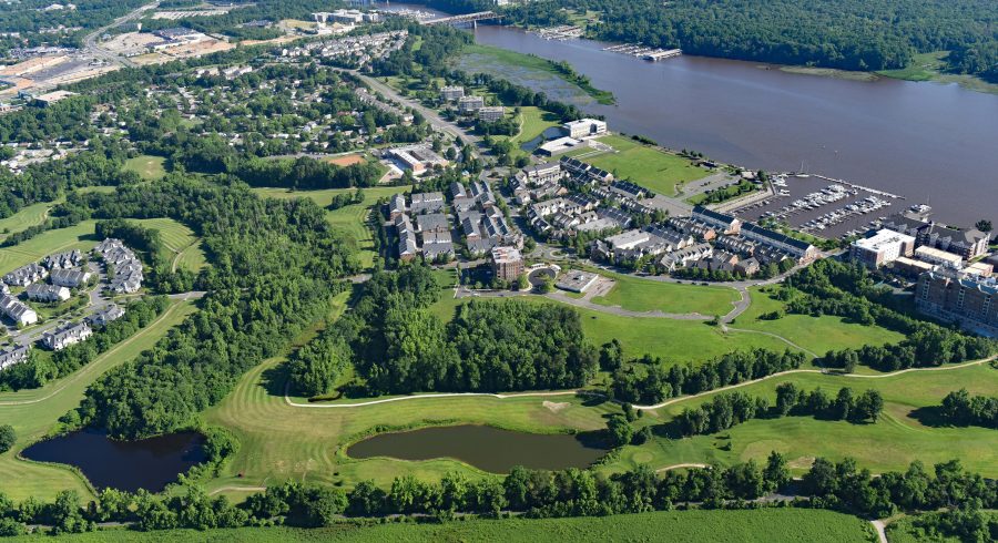 Aerial view of Belmont Bay neighborhoods with small ponds and the bay.